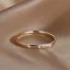 Placeholder: delicate thin ring with tiny diamond, stacked rings