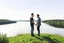 Placeholder: An image of two people exchanging criticism in a constructive and respectful manner, standing on a hill with a lake behind them