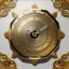 Placeholder: large crystal ornate square and round clock with a transparent body, wooden and black and gold, transparent, rococo, Artstation, intricate and meticulously detailed 8 k, ornate and jewels, bokeh background