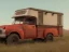 Placeholder: red truck with old camper