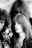 Placeholder: Jim Morrison and Pamela Courson ,music, ignoreNSFW, watermark, bohemian style , blurry,beautiful,elegant,roses, fantasy