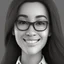 Placeholder: a portrait of smiling woman wearing formal shirt. long black hair. light brown skin. black eye pupils. big nose. oval face shape. wearing glasses. pixar style. headshot. 3D. 4k. portrait. highly detailed. sharp focus. high resolution. full color. cinema lighting