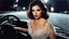 Placeholder: [artistic photo by Tony Kent (1980)] a brunette driving a car bends over to speak, she looks at the camera, she is going to a party, she is mysterious and her dress does not conceil much, the street is dark