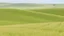 Placeholder: Gentle, rolling grasslands.