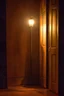 Placeholder: scene for a theatre play where the stage is dark and empty, the only source of light is a vintage house lamp, a giant open book standing up and a fairy door