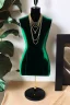 Placeholder: dark green velvet Necklace Mannequin Stand on a luxury table