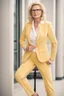 Placeholder: Powerful classical portrait of a modern blonde politician with glasses in her early forties wearing a pastel yellow pant suit standing in a elegant position