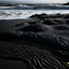 Placeholder: black sand waves