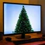 Placeholder: Christmas tree displayed on the monitor of a computer