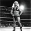 Placeholder: [photo by Helmut Newton] The Nordic wrestler, Bjorn Thunderstruck, stood tall and imposing in the arena, his blonde hair gleaming under the torchlight. Across from him, the Mexican wrestler, Maria Azteca, exuded a fiery intensity, her dark eyes flashing with determination.
