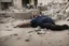 Placeholder: Man with no legs lying in ruins in Gaza