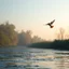 Placeholder: Hyper Realistic early morning (6:40 am) scene of a riverside where a beautiful small bird flying just few inches above the river water showing dramatic and cinematic ambiance.