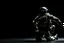 Placeholder: toy soldier military operation apocolypse looking away from camera to right corner black floor black blackground