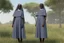 Placeholder: 4 suore africane con tunica grigia figura intera fino ai piedi