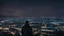 Placeholder: An Englishman in a bomber jacket standing at the top of a tall building looking across a city at night