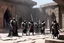 Placeholder: Four Klingon warriors gather in the stone courtyard of a fortress on Qo'noS, checking their traditional weapons before the battle. On the left, a warrior tests the weight of his massive bat'leth, while his comrades sharpen their d'k tahg daggers and mek'leth blades. Armor of leather, fur and spiked steel, braided hair, and banners of the Empire blowing in the cold mountain wind. No phasers. No mercy. Only Kahless' legacy. Inspired by Star Trek TNG / DS9 Klingon culture.