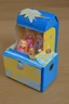 Placeholder: empty yellow and blue barbie doll box