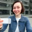 Placeholder: A short haired, female software engineer taking a selfie in front of Building 92 at Microsoft