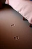 Placeholder: cheap motel room floor, bed leg imprints in carpet, showing that furniture had been moved