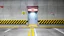 Placeholder: wall design for parking garage, concrete, yellow painted hazard lines, weathering and water stains, in middle is an exit doorway with small window, with a sign is above. rough painted hashmarks and parking lines, add signage found in a parking garage.