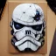 Placeholder: photorealistic death trooper helmet with weathered painting , illustration on coarse canvas by <agnes cecile> and <Yoji Shinkawa>, ornate and intricate details , soft smooth lighting, ultra detailed concept art,