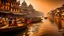 Placeholder: This image depicts a bustling scene along the ghats of the Ganges River in Varanasi, India. The light of dawn or dusk casts a warm golden hue on the historic architecture, characterized by ancient stone buildings and colorful facades. The atmosphere is filled with smoke, likely from nearby ceremonial fires, which contribute to a mystical and spiritual mood. The traditional attire worn by the people includes saris, shawls, and turbans, with most dressed in white and earthy tones, indicating parti