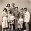 Placeholder: awkward family photo, all wearing the same type of clothes, 1960s, big mustaches