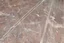 Placeholder: scratched garage floor, from very low perspective