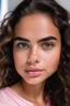 Placeholder: a tanned girl with thick eyebrows and eyelashes, brownish eyes, pink lips, long brown wavy hair and dimples