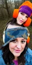 Placeholder: Brunette taking selfie.thick thighs,thick calves,flat belly,curvy fell. big head. Mantle is sewed of upcycled Denim and sewed together of camouflage pieces. Pieces' color are orange, cream and purple. It is with big bright purple felt tippet and redochre-colored-hood is merged with colorful beanie. Big colored headphones (gold rings!) is merged with small felt cap with small visor. Style: Haute Couture in 1950's Africa, N.Y.C fashion in 2023