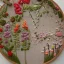 Placeholder: exquisite whimsical garden in embroidery hoop, intricate, highly detailed, linen and wood backdrop