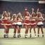 Placeholder: [vintage style noisy scratches glitches] 1970s cheerleaders