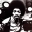 Placeholder: Jimi Hendrix at a turntable with headphones on being a DJ