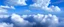 Placeholder: blue sky with clouds