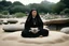 Placeholder: [very impressive high res masterpiece in Kodak Eastman 5247, bokeh scene by Stanley Kubrick] a gangsta nun covered by tattoos, a mysterious figure who defies convention, meditating in the lotus position on a rock outside. The serene setting of a zen garden surrounds her, the sand meticulously raked in intricate patterns, creating a sense of calm and balance in the midst of chaos.
