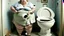 Placeholder: big lady standing next to broken toilet