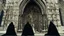 Placeholder: black robed monks standing before a massive cathedral