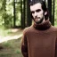 Placeholder: a full picture of a tall skinny man with greasy hair wearing a woolen sweater outside in nature