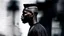 Placeholder: minimal profile shot of an African cyberpunk individual with a striking mohawk hairstyle and intricate shaved patterns on the side of their head, wearing a black and white horizontal thin striped shirt. The background is a blurred, high-contrast mix of black and white lines, suggesting motion and urban settings; overheat, dramatic, cinematic, sudden jolt dynamics, great parallels, great reflections, unsettling shadows, surreal futurist architecture art, surreal liminal space, tribal style, triba