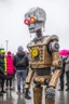 Placeholder: little people looking at dancin to giant robotvitalik buterin at burning man festival in the rain