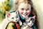 Placeholder: A cute smiling Norwegian girl is holding a kitten. Watercolour