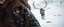 Placeholder: creature with eyes of hound bison reindeer yoga man with the snow flake pattern in the pupils in running in the snow in the snowy mountain