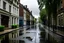 Placeholder: A wet street in a small English town