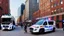 Placeholder: A police Tesla Cybertruck is chasing a Tesla 'Model S Plaid' at top speed, on the South Street Seaport, in New York. CINEMATIC. WIDE ANGLE LENS. PHOTO REAL.