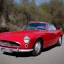 Placeholder: Red metetallic Volvo p1800 drive at route 66