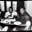 Placeholder: Martin Luther King Jr. and Wario eating pizza at a Denny's restaurant