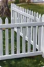 Placeholder: white vinyl fence in yard, photograph