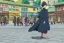 Placeholder: One single mature crow with russian folk clothes, dancing on the street, Moscow, happy, perfect iris, colours, model style, hyper realistic, extremely accurate, delicate, extremely detailed, Graphic novel style, wide-angle, open aperture, superfine pencil