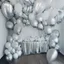 Placeholder: A picture of a room filled with silver party decoration. Include balloons, garlands, foil balloons