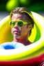 Placeholder: brad pitt sitting in donut swim ring with swimming-goggles on